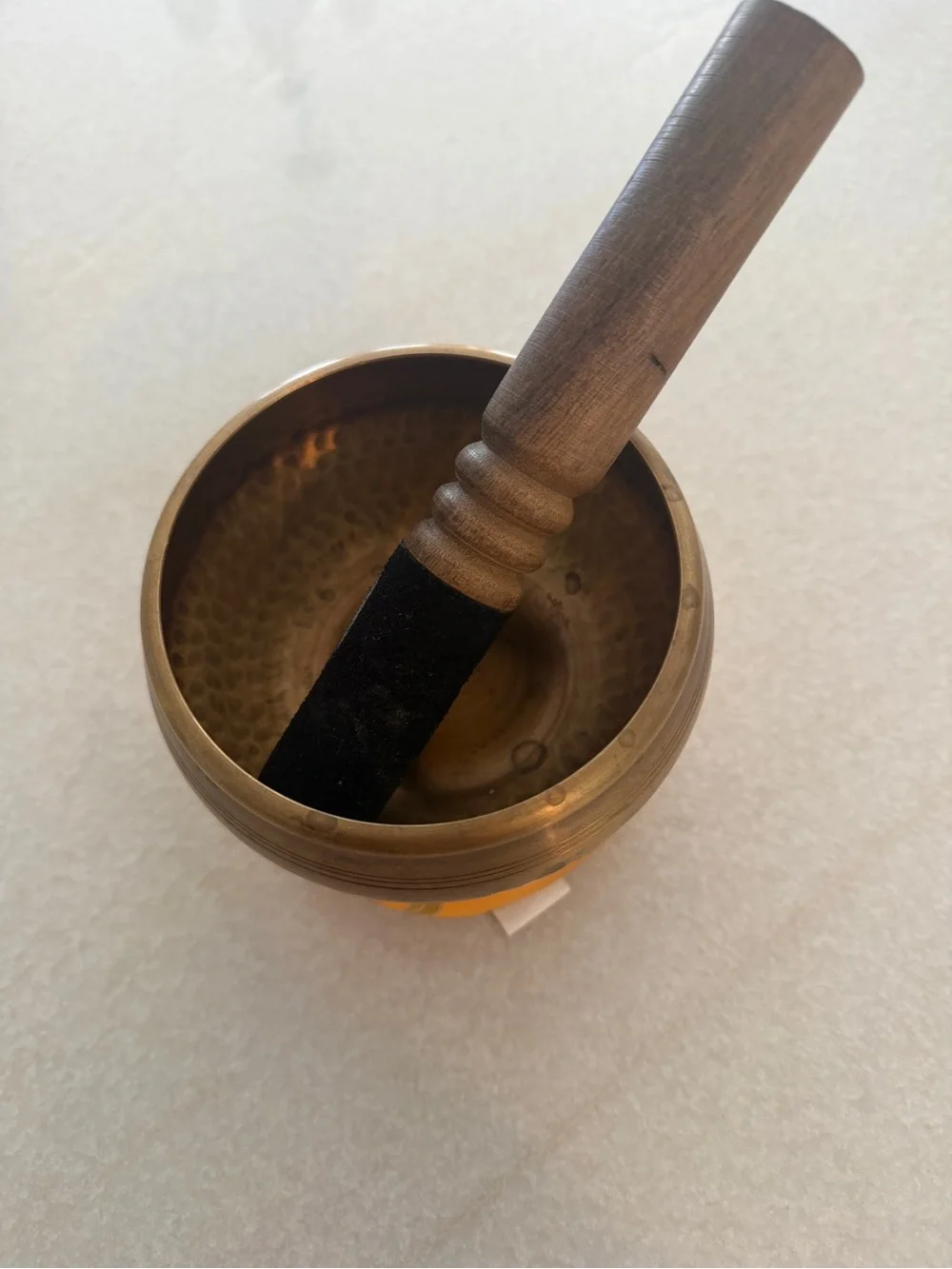Vintage Brass Singing Bowl with Wooden Mallet on Gold-Patterned Cushion - Picture 2 of 6